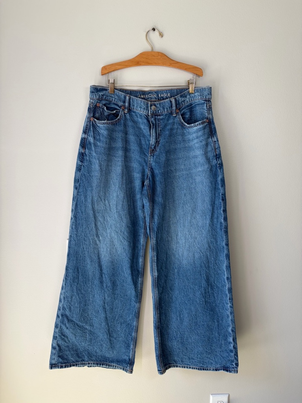 American Eagle Dreamy Drape Strigid Low-Rise Ultra Wide-Leg Jeans - Picture 2 of 12